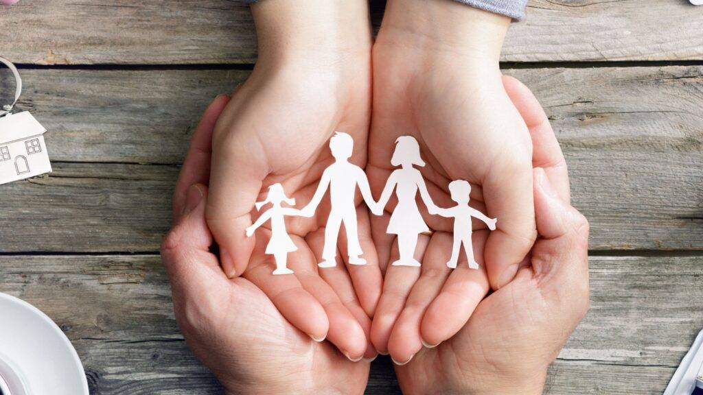 image of a paper chain family in the hands of someone else