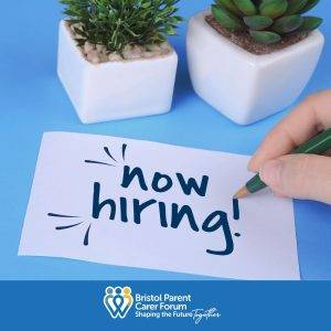 Now hiring written on a slip of paper